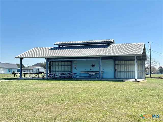a front view of a building with garden