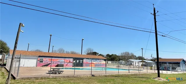 a view of a lake with houses in the background