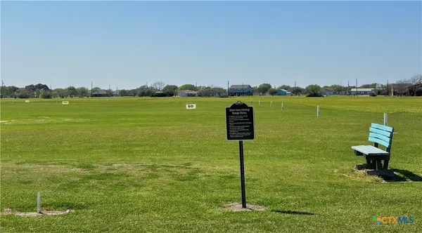 a view of a lake with a yard