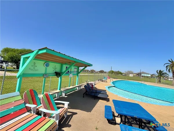 a view of a patio with swimming pool