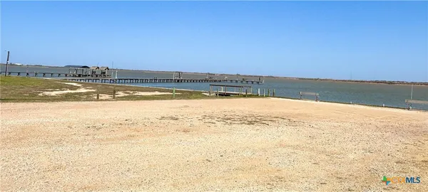 a view of a yard with swimming pool