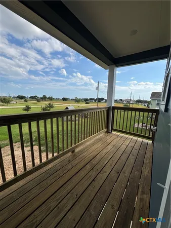 a view of deck with wooden floor and fence