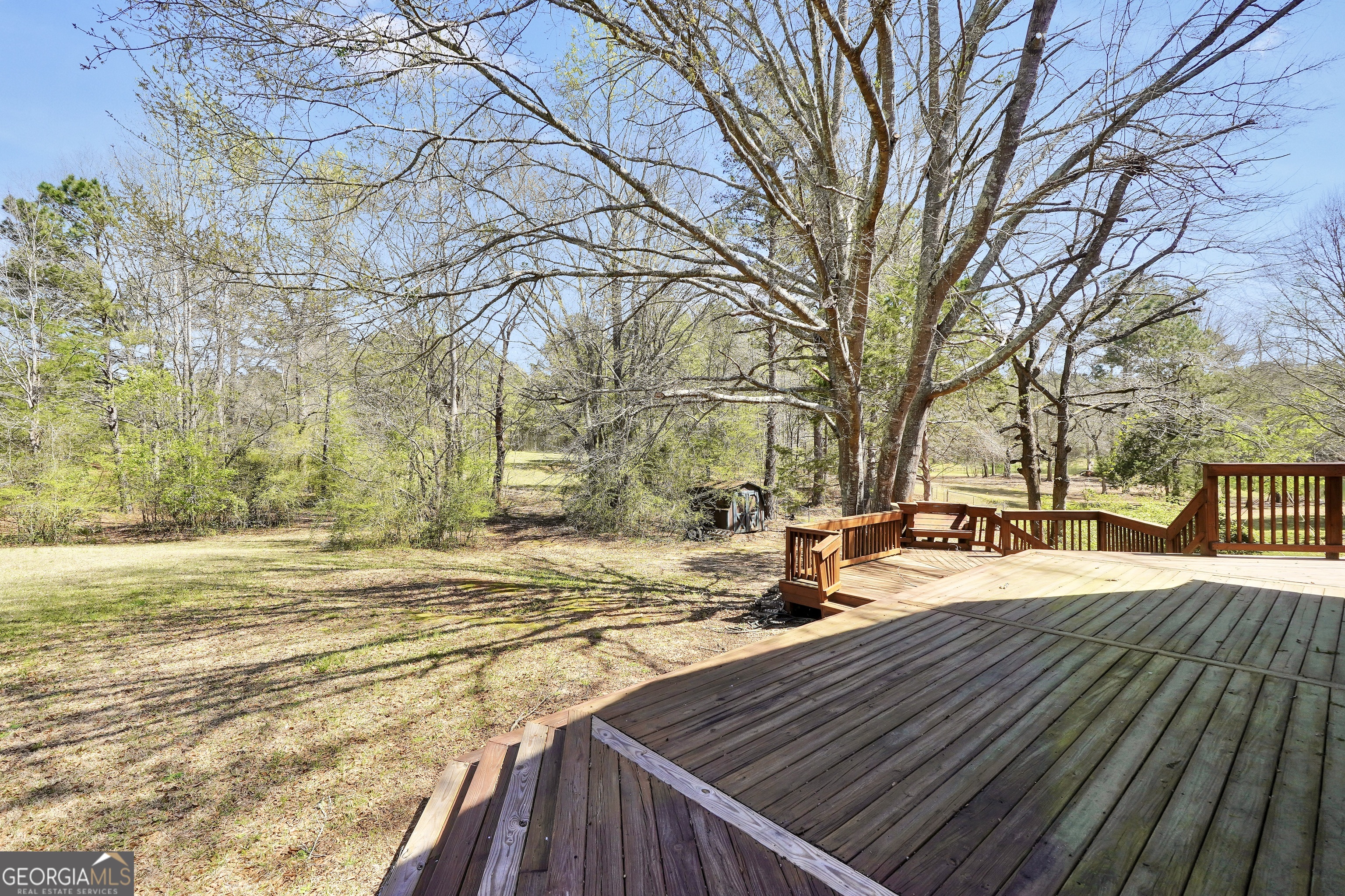 330 Country Kitchen Road Barnesville, GA 30204 - Photo 12 of 64 a view of a yard with trees and sitting area