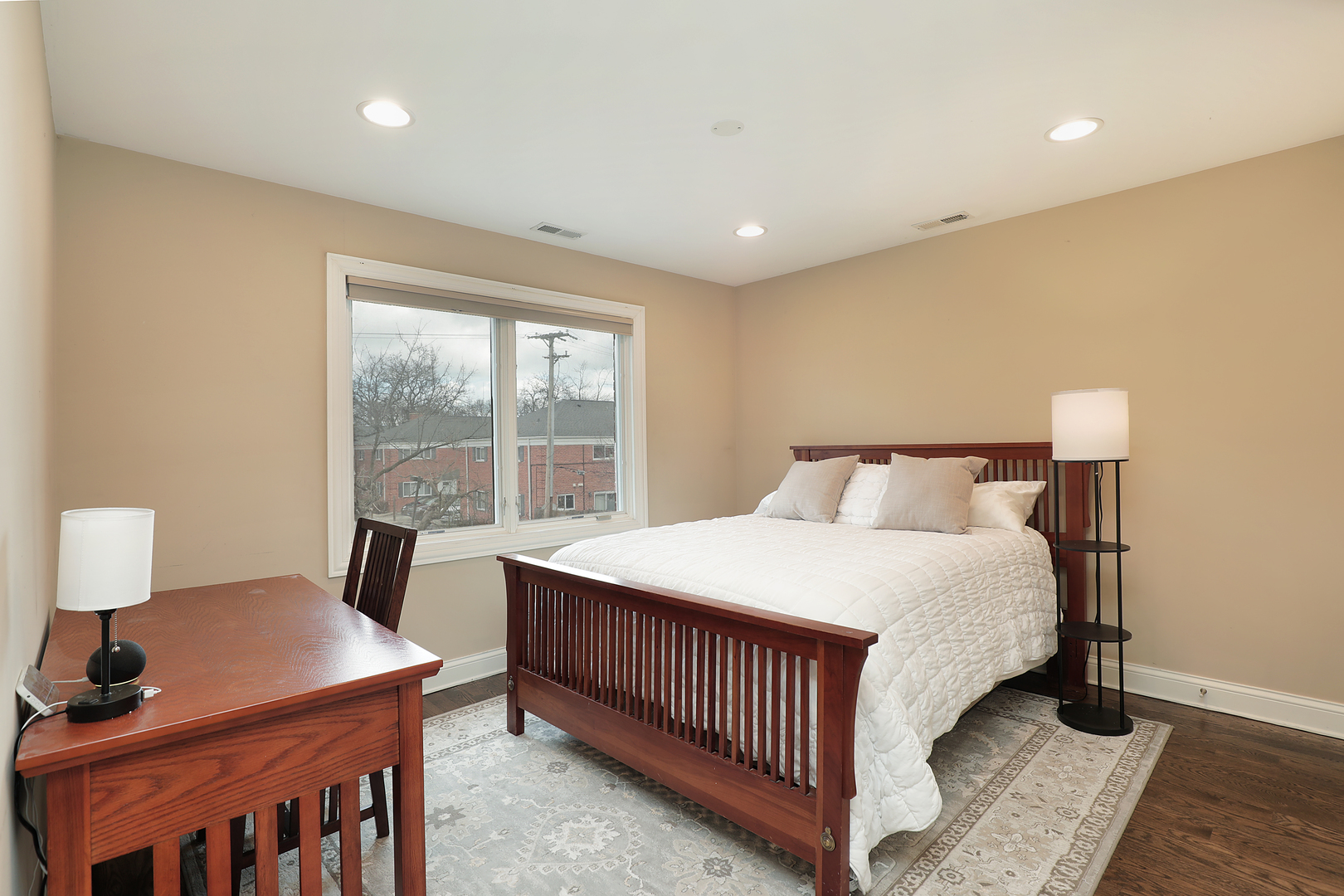 2026 Maple Avenue Northbrook, IL 60062 - Photo 11 of 18 a bedroom with a bed and wooden floor