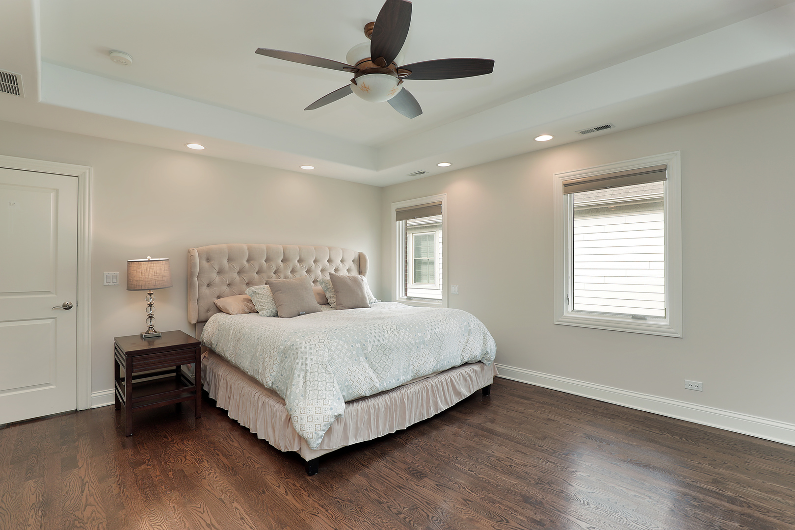 2026 Maple Avenue Northbrook, IL 60062 - Photo 8 of 18 a bedroom with a bed and a ceiling fan