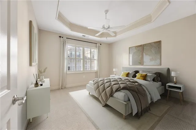 a bedroom with a bed couch and window