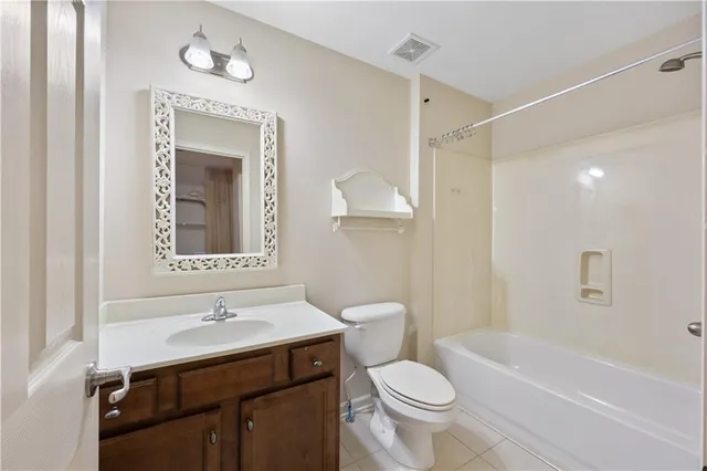 a bathroom with a sink toilet a mirror and shower