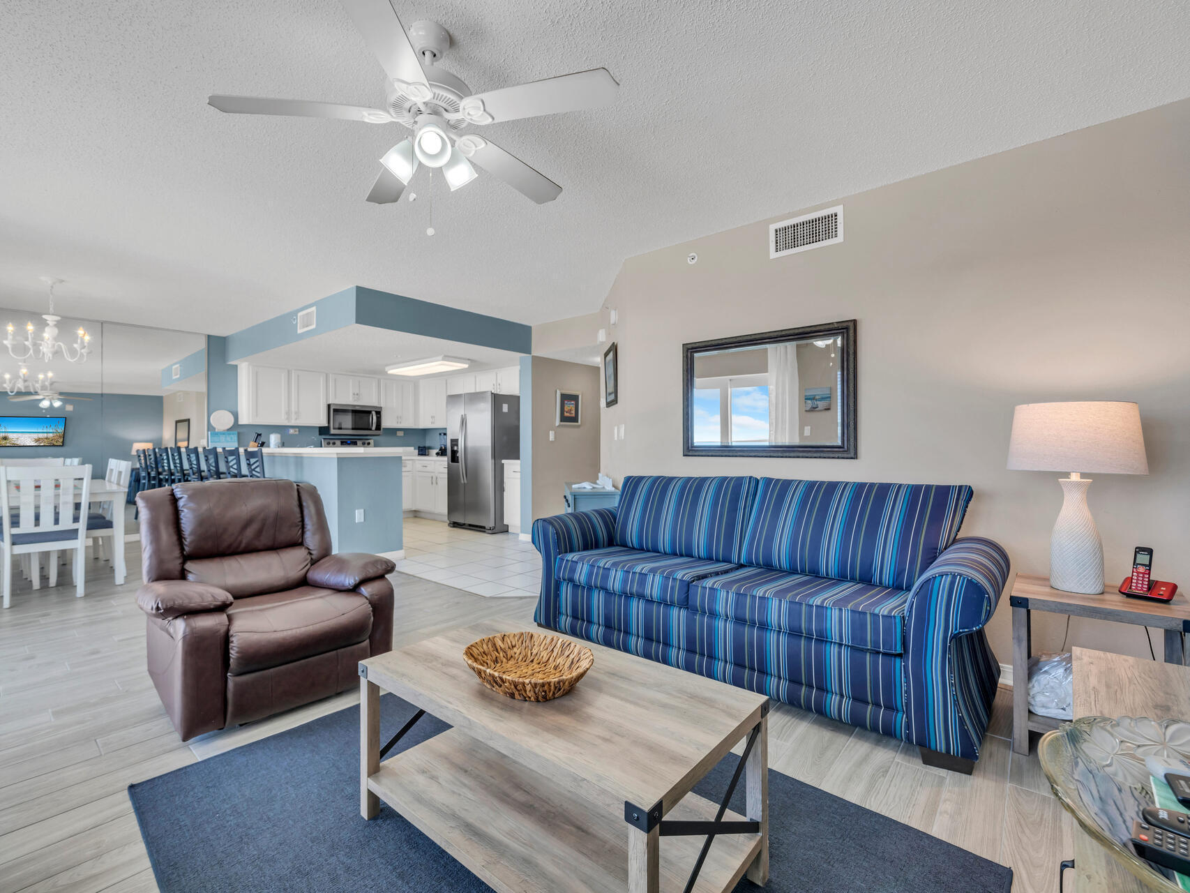 790 Santa Rosa Boulevard, Unit 6002 Fort Walton Beach, FL 32548 - Photo 11 of 42 a living room with furniture ceiling fan and a rug