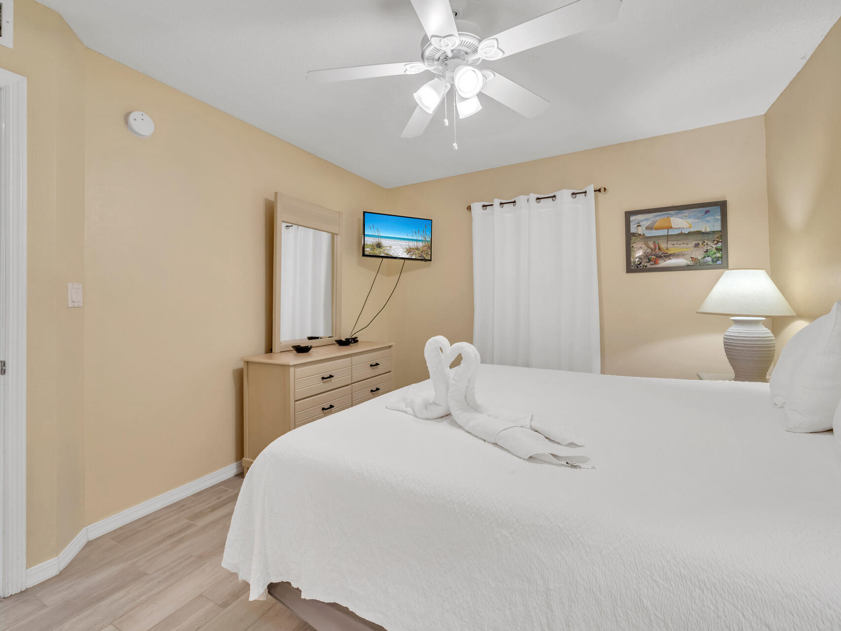 790 Santa Rosa Boulevard, Unit 6002 Fort Walton Beach, FL 32548 - Photo 19 of 42 a bedroom with a bed and a chandelier