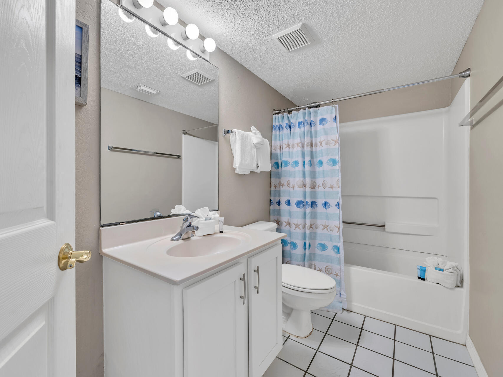 790 Santa Rosa Boulevard, Unit 6002 Fort Walton Beach, FL 32548 - Photo 24 of 42 a bathroom with a sink a toilet and shower