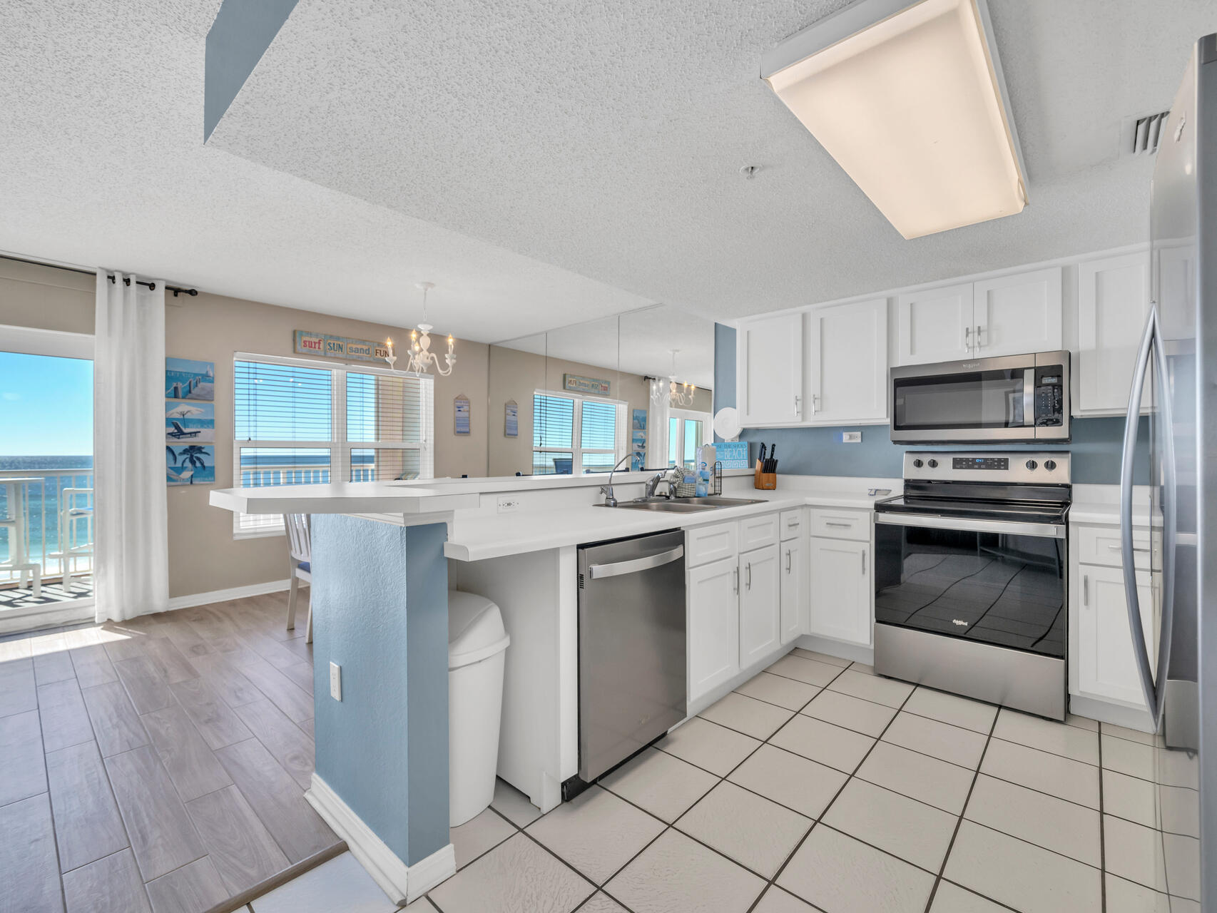 790 Santa Rosa Boulevard, Unit 6002 Fort Walton Beach, FL 32548 - Photo 7 of 42 a kitchen with a sink cabinets and stainless steel appliances