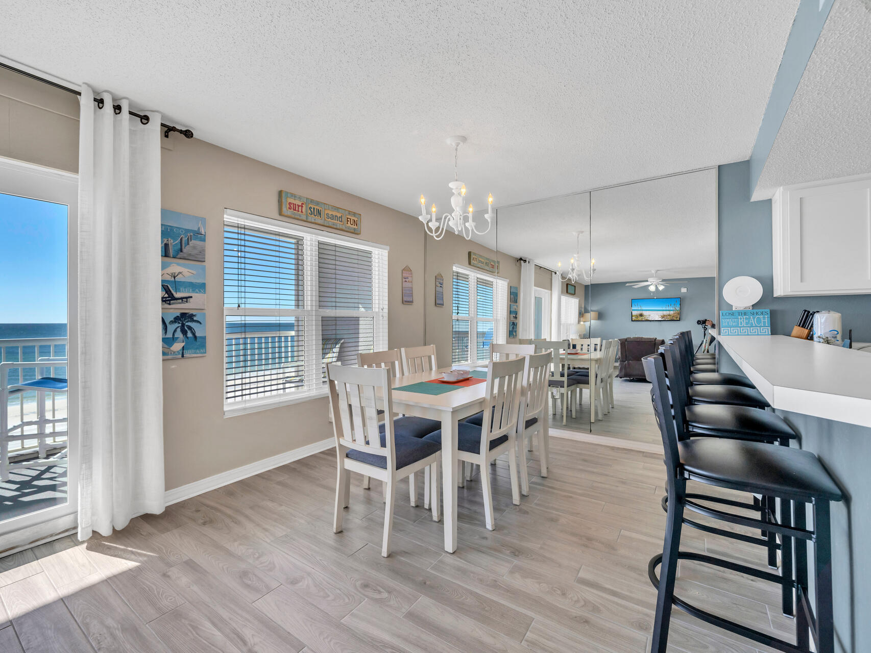 790 Santa Rosa Boulevard, Unit 6002 Fort Walton Beach, FL 32548 - Photo 8 of 42 a view of a dining room with furniture and wooden floor