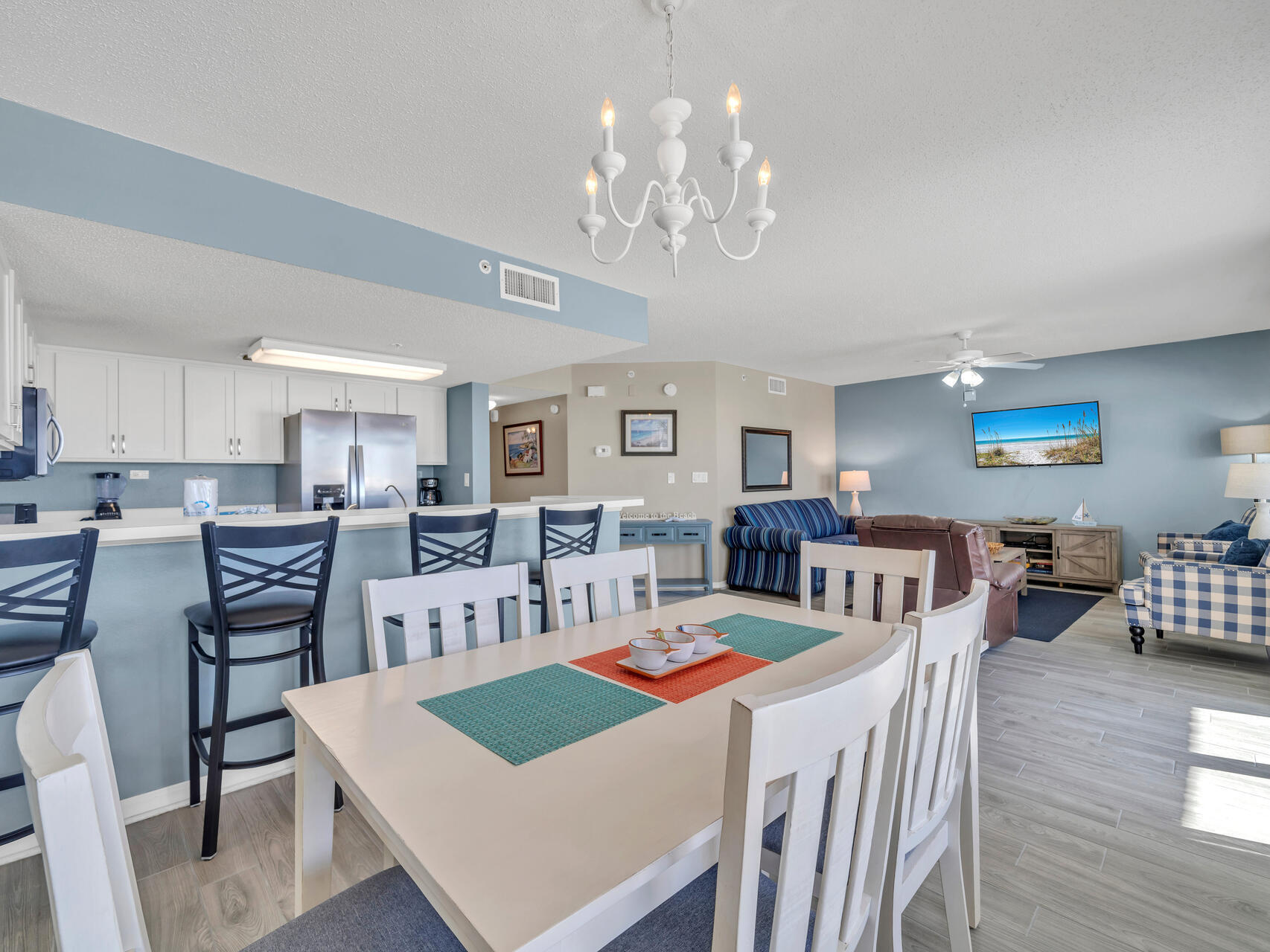 790 Santa Rosa Boulevard, Unit 6002 Fort Walton Beach, FL 32548 - Photo 9 of 42 a view of a dining room with furniture and wooden floor