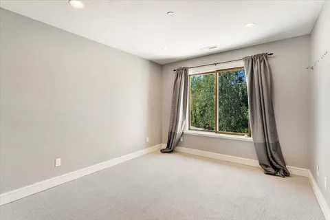 a view of room with window and floor to ceiling window