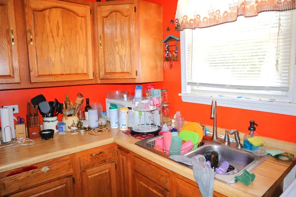 a kitchen with stainless steel appliances granite countertop a sink and a window