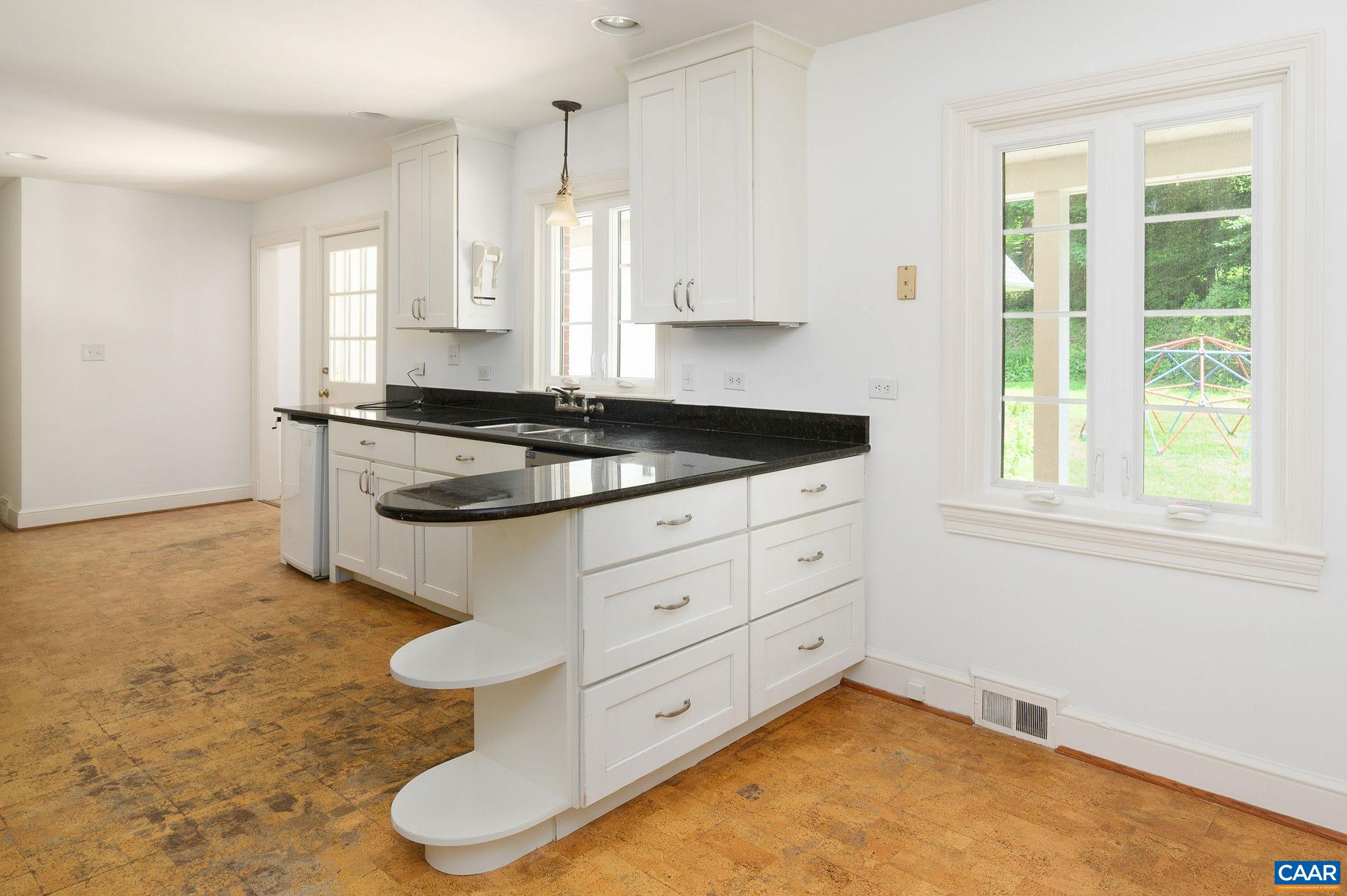 906 Old Farm Road Charlottesville, VA 22903 - Photo 11 of 46 a kitchen with stainless steel appliances granite countertop a stove a sink and a granite counter tops with white cabinets