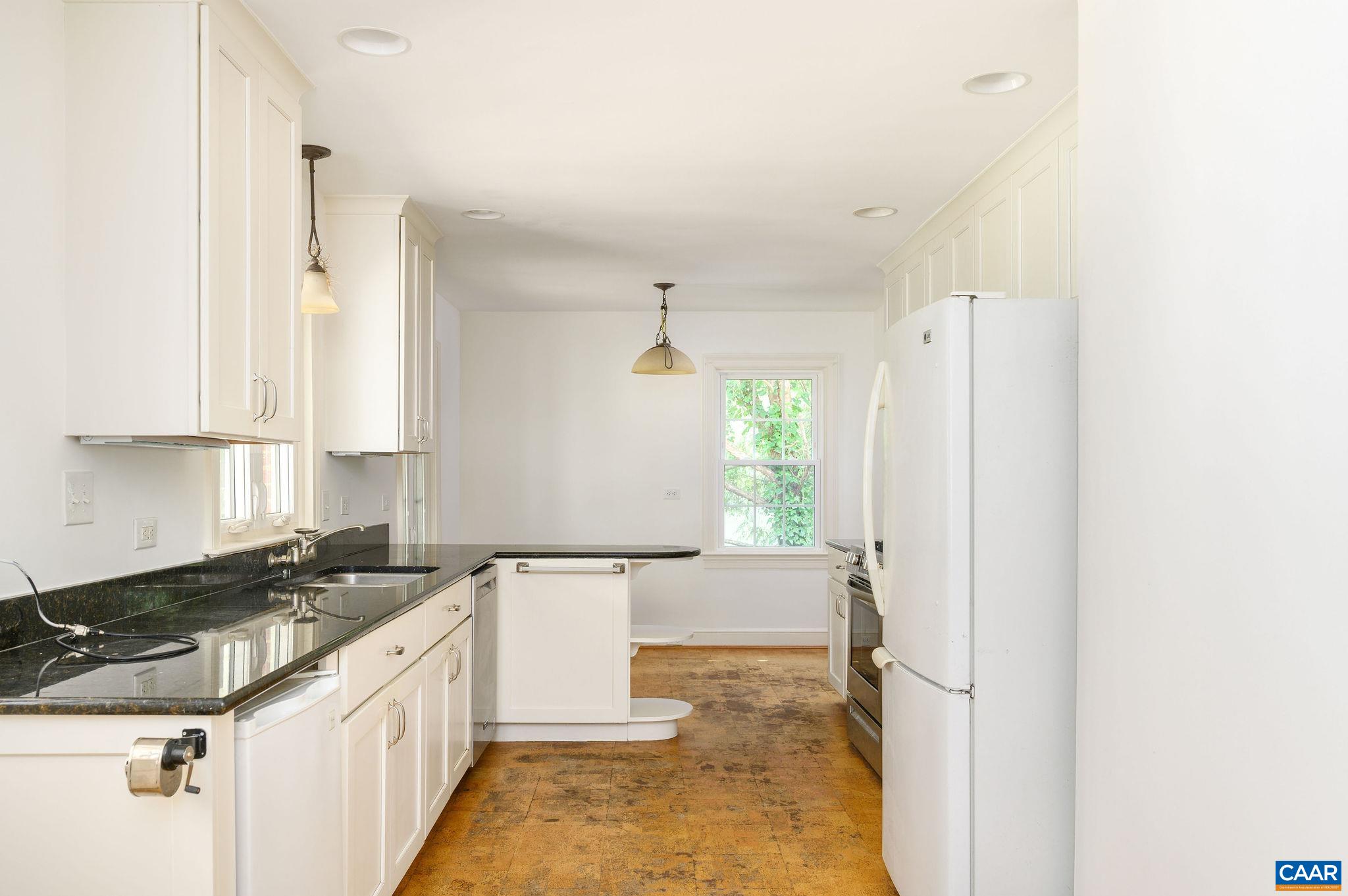 906 Old Farm Road Charlottesville, VA 22903 - Photo 13 of 46 a kitchen that has a sink and a stove