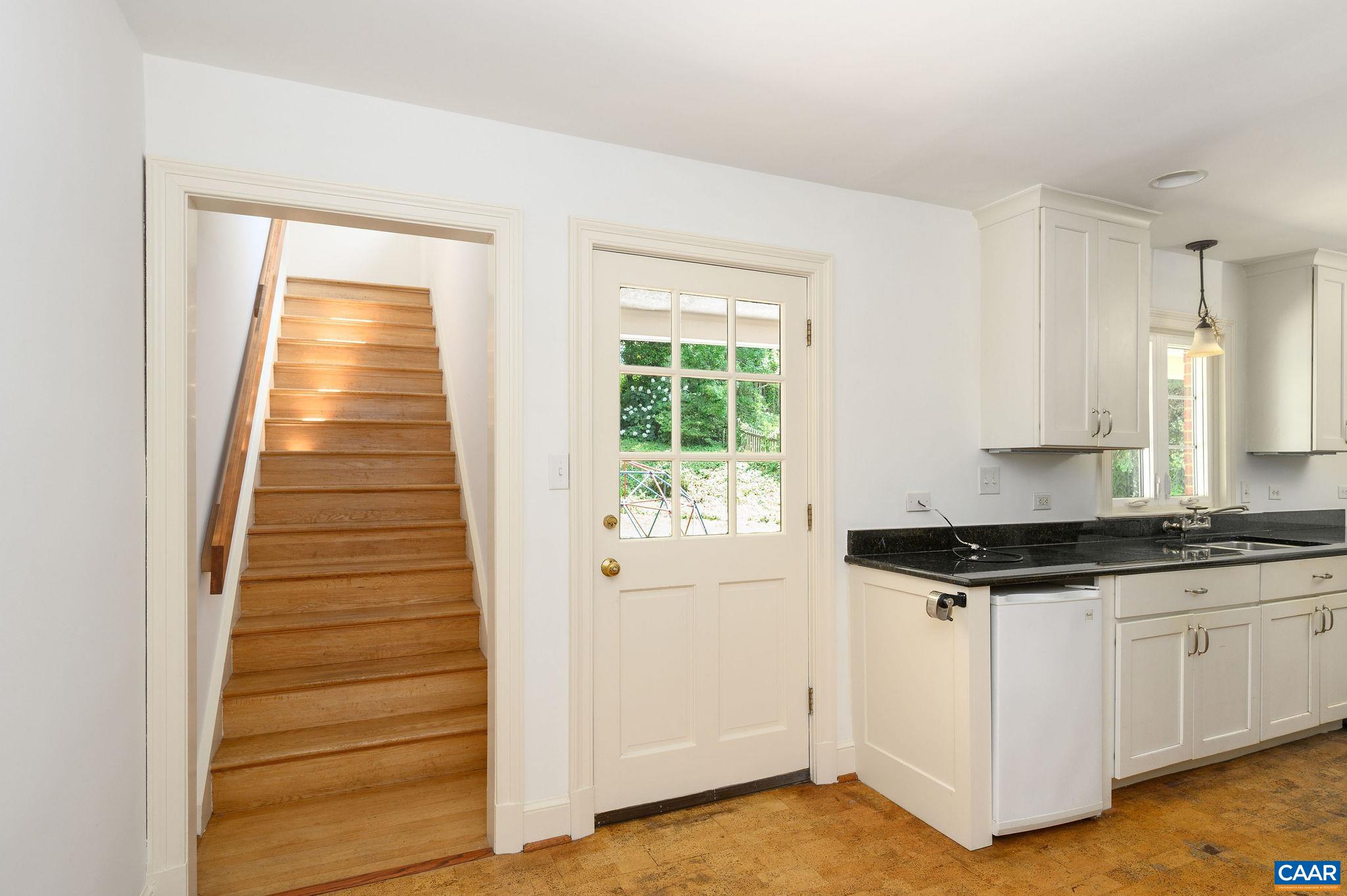 906 Old Farm Road Charlottesville, VA 22903 - Photo 14 of 46 a kitchen with granite countertop a stove a sink and dishwasher with white cabinets