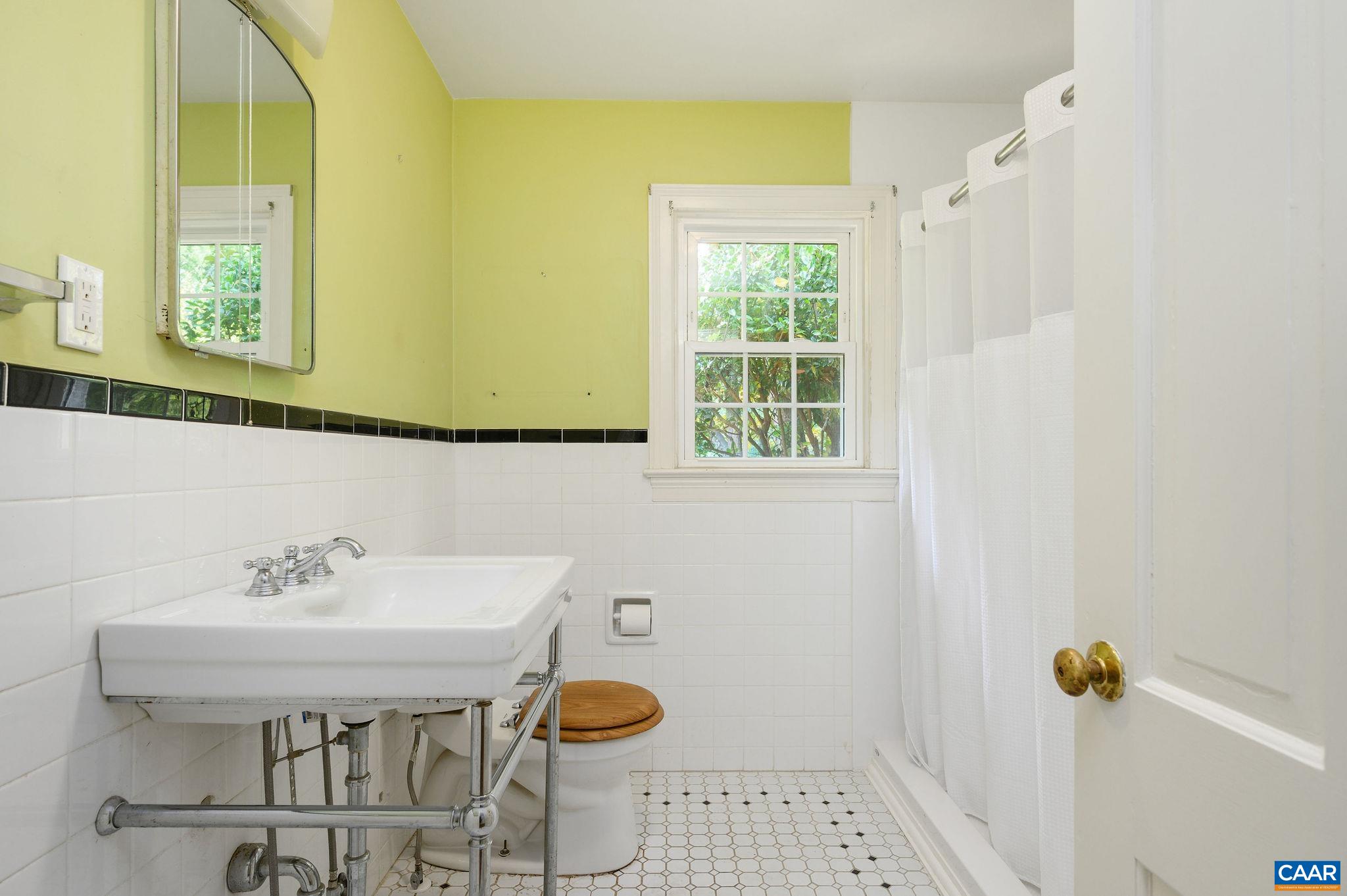 906 Old Farm Road Charlottesville, VA 22903 - Photo 22 of 46 a bathroom with a sink a toilet and a mirror