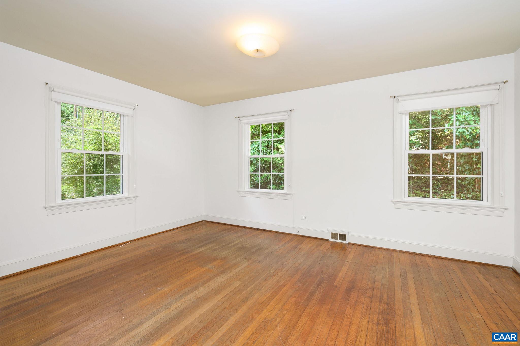 906 Old Farm Road Charlottesville, VA 22903 - Photo 23 of 46 a view of an empty room with wooden floor and a window