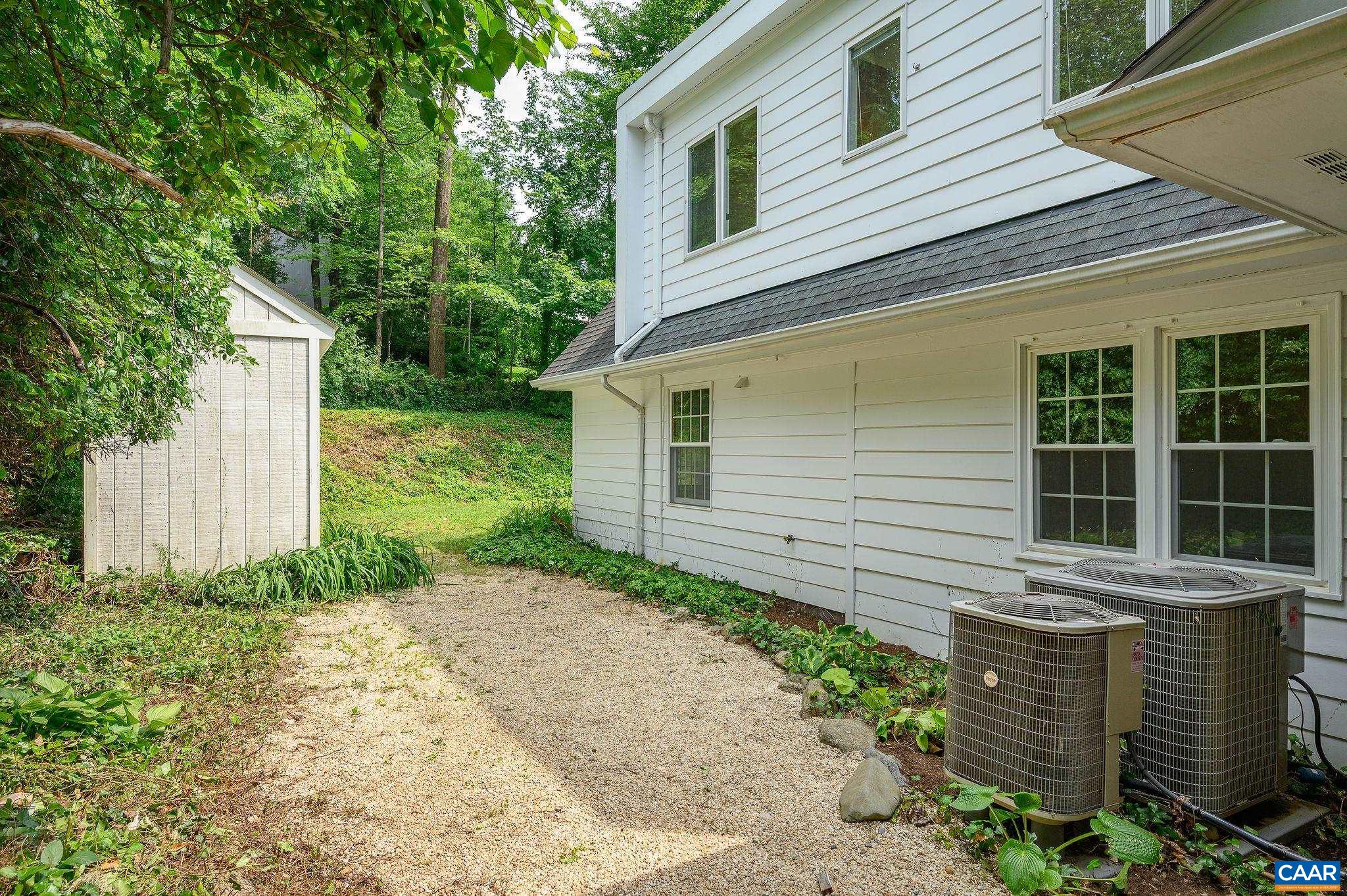 906 Old Farm Road Charlottesville, VA 22903 - Photo 35 of 46 a view of a backyard with plants and large tree