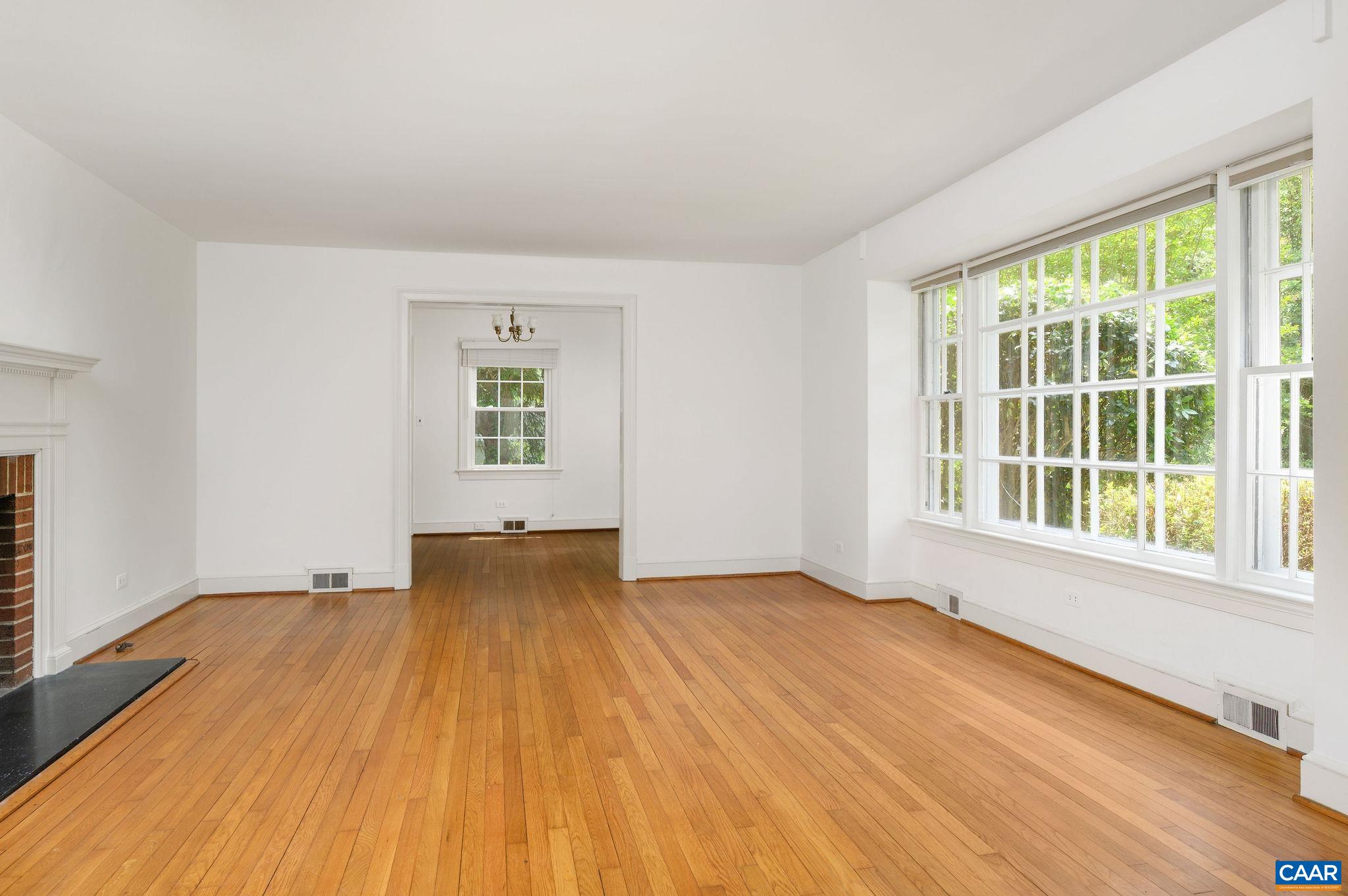 906 Old Farm Road Charlottesville, VA 22903 - Photo 5 of 46 a view of an empty room with wooden floor and a window