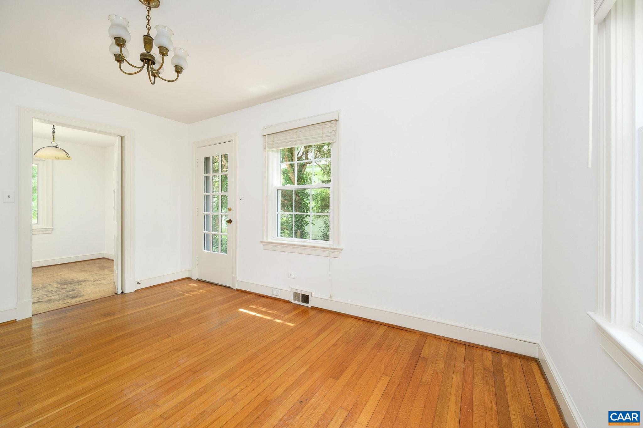 906 Old Farm Road Charlottesville, VA 22903 - Photo 8 of 46 a view of an empty room with wooden floor and a window