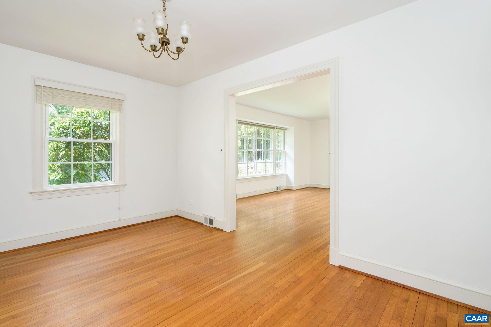 906 Old Farm Road Charlottesville, VA 22903 - Photo 9 of 46 an empty room with wooden floor and windows