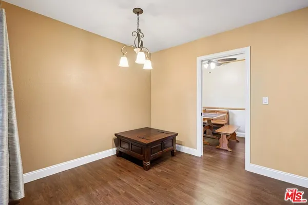 a living room with a couch and wooden floor