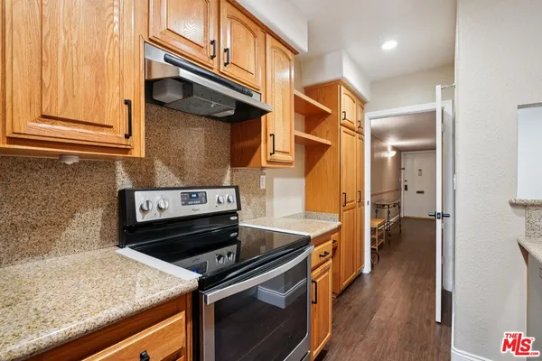 a kitchen with a stove and a microwave