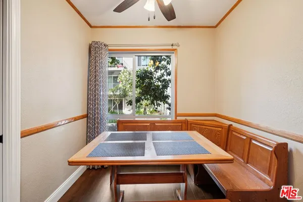 a room with pool table and a window