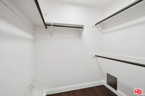 a view of an empty walk in closet
