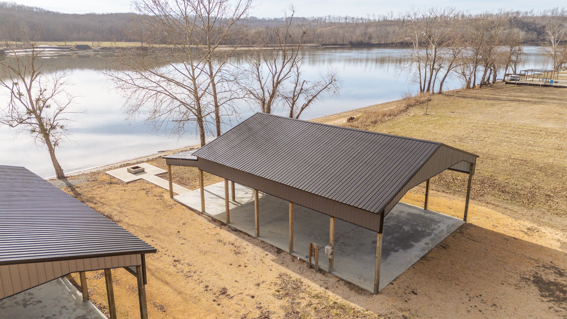 235 Hardin Bottom River Road Clifton, TN 38425 - Photo 2 of 42 a view of a terrace with wooden floor and lake view
