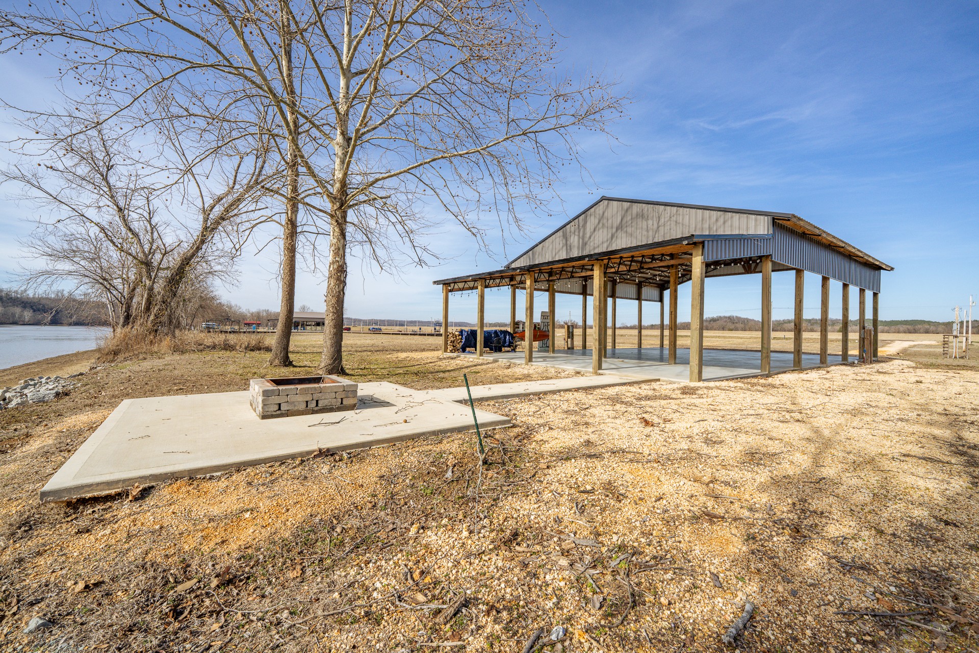 235 Hardin Bottom River Road Clifton, TN 38425 - Photo 22 of 42 a house with trees in front of it