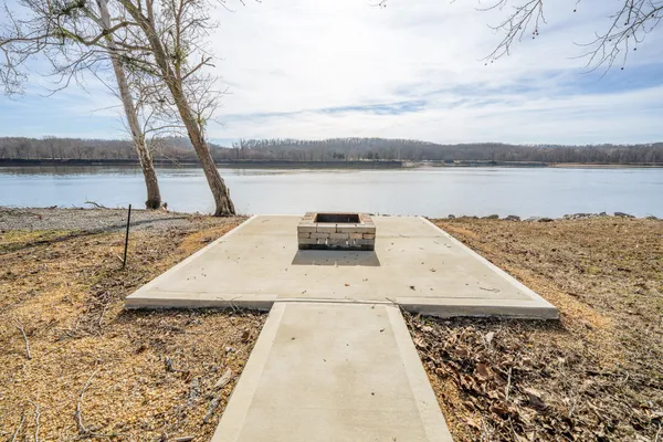 a view of lake with a yard