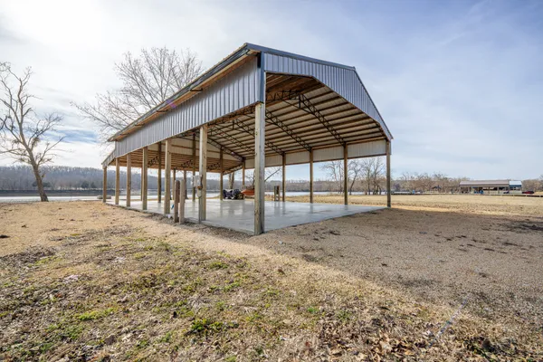 a view of a backyard with wooden fence
