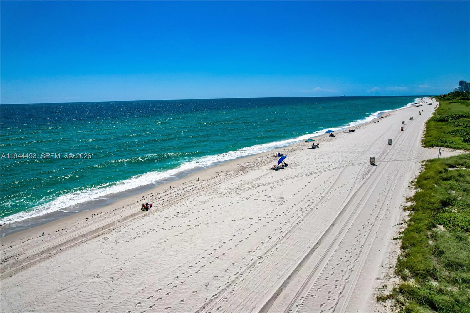 9225 Collins Avenue, Unit 705 Surfside, FL 33154 - Photo 16 of 17 a view of an ocean beach