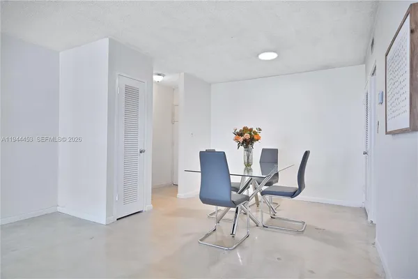 a workspace with furniture and a potted plant