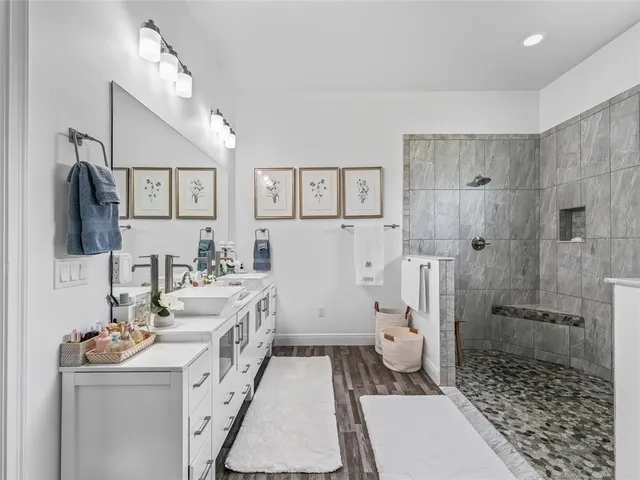 a bathroom with a toilet sink and shower
