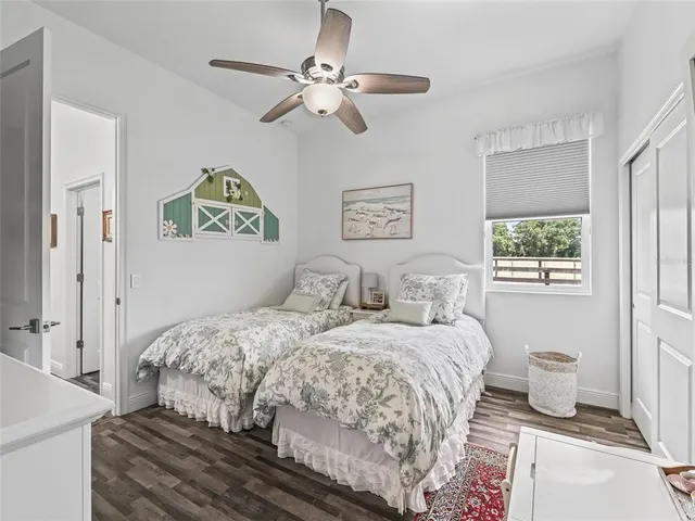 a kitchen with cabinets and wooden floor