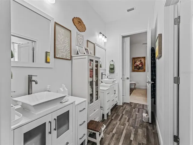 a bedroom with a bed chair and window