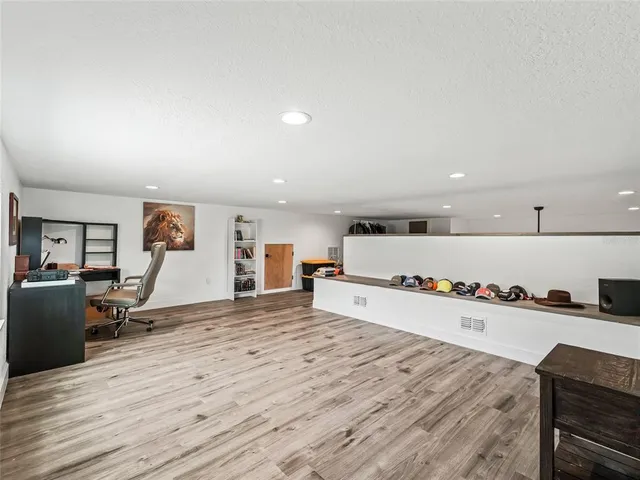 a view of a livingroom with furniture and a window