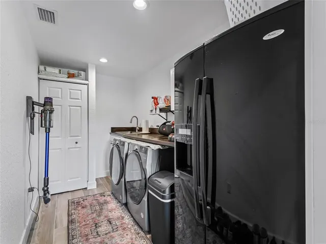 a view of a patio with a dining table and chairs