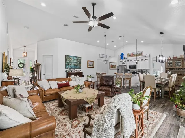 a living room with lots of furniture and white walls