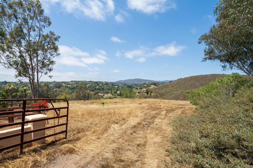 18096 Loma Alegre Rancho Santa Fe, CA 92067 - Photo 12 of 21 a view of a terrace with a bench