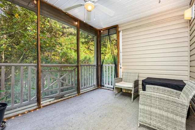 a view of a street with a house in the background