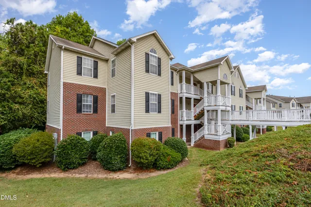 a front view of a house with wooden stairs