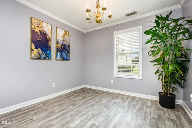 a view of a room with window and flower pot