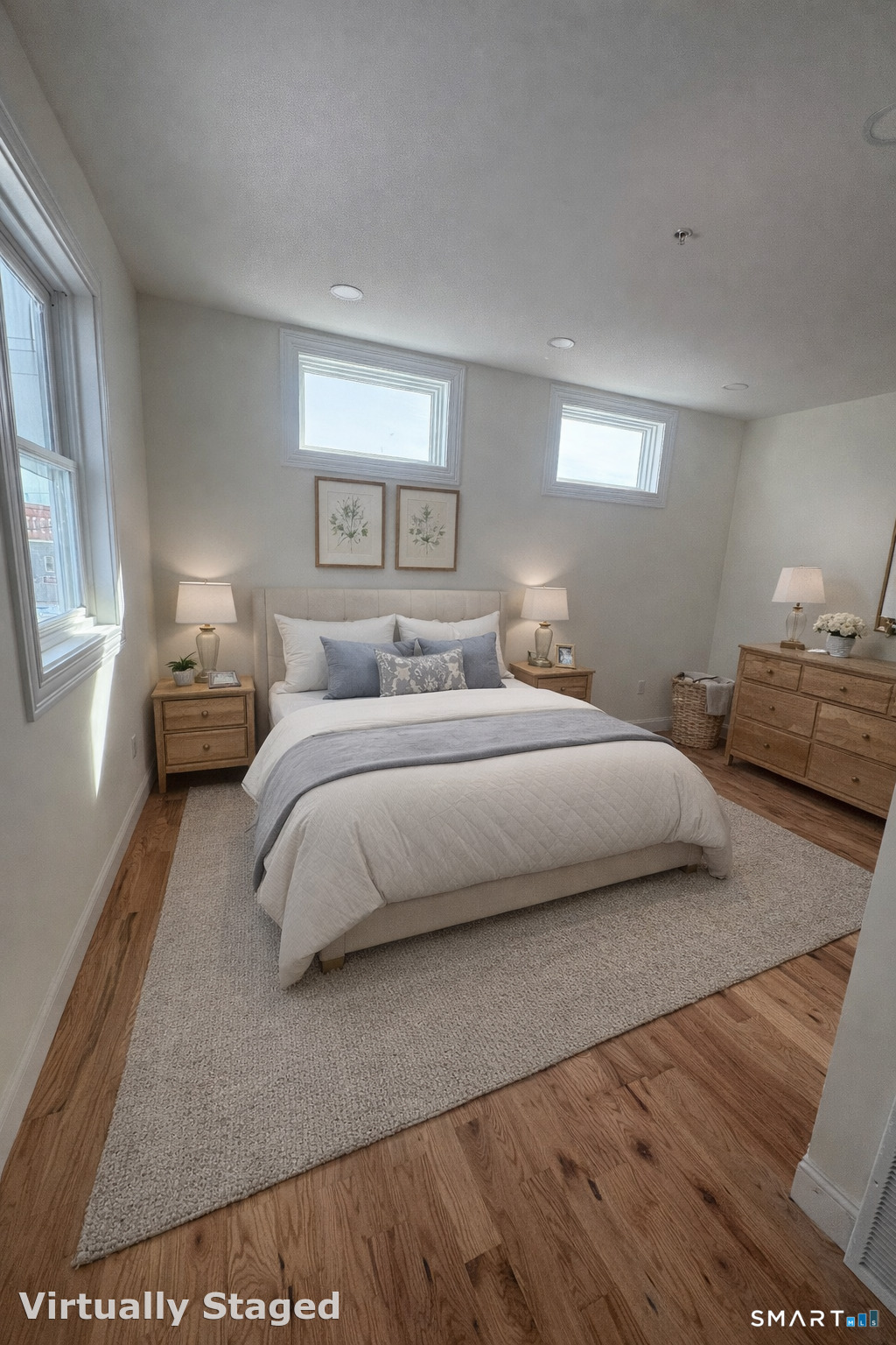 157 Green Street, Unit 1B New London, CT 06320 - Photo 4 of 5 a bedroom with a bed and wooden floor