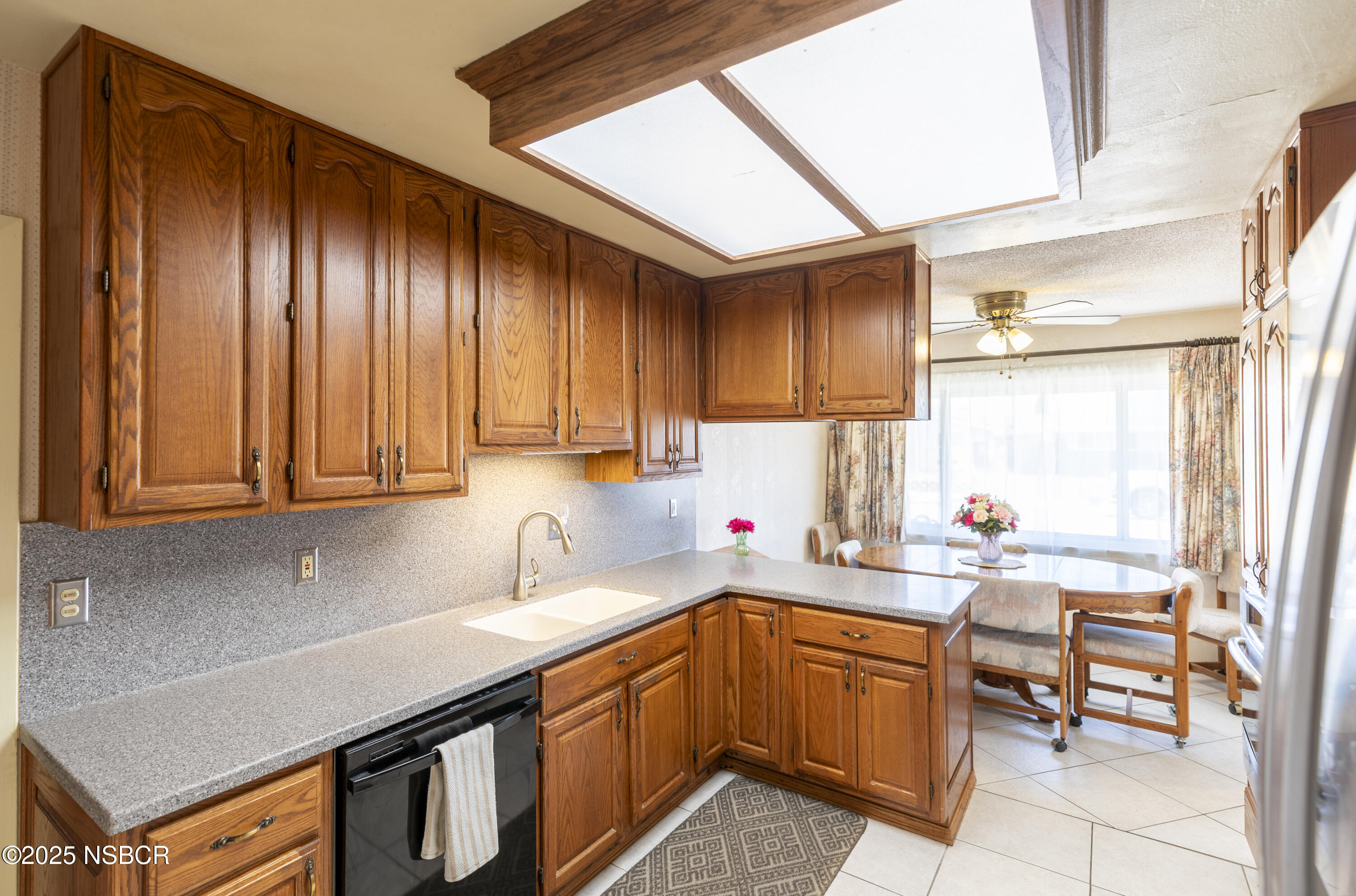 3361 Via Elba Lompoc, CA 93436 - Photo 11 of 40 a kitchen with a sink cabinets and window